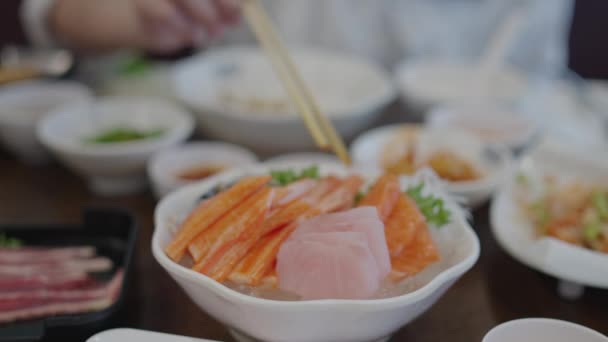 Asian Woman Eating Sashimi Salmon Woman Using Chopstick Pick Raw — Stockvideo