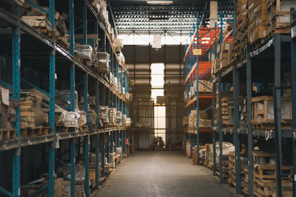 Industrial business warehouse storage of retail shop .Warehouse interior with shelves rack for keep production material, pallets and boxes. Empty warehouse full of cargo. Industrial concept.