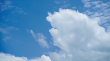 Time-lapse footage summer blue sky clouds background. Beauty clear cloudy in sunshine calm bright winter air background.
