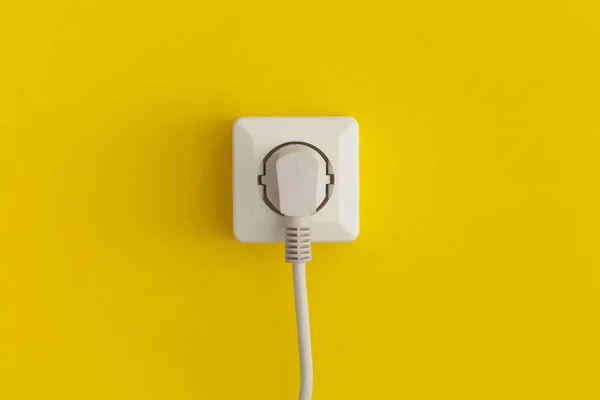 White Plastic Power Socket Yellow Background 로열티 프리 스톡 이미지