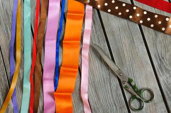 Multicolored Silk Ribbons Vintage Scissors Wooden Table Planks Top View — стоковое фото