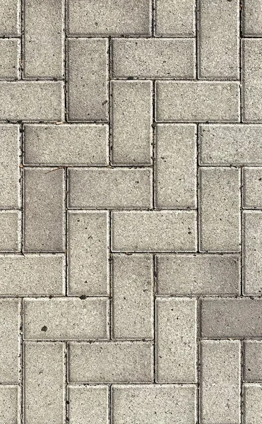 Dekoratif taş oymalı kaldırım taşları kaldırım taşı yol yolu dikey arkaplan üzerinde yol deseni