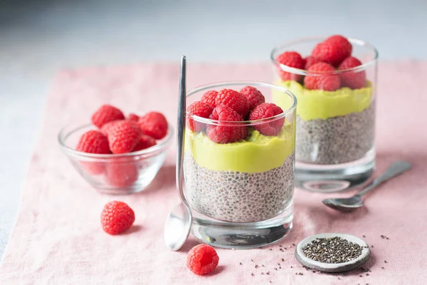 Chia pudding with avocado and raspberries Stock Photo