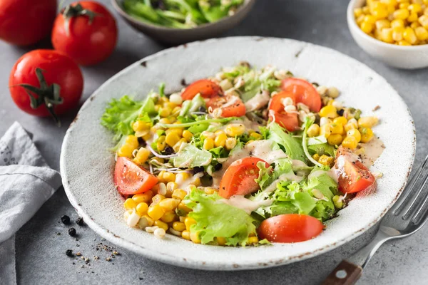 Healthy vegan vegetable salad with sweet corn and cashew sauce Royalty Free Stock Photos