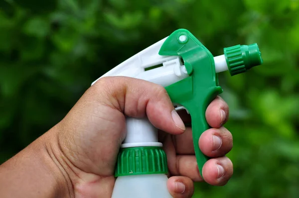 Man Holding Plastic Bottle Sprayer Water Selective Focus Green Leaves — Stock Photo, Image