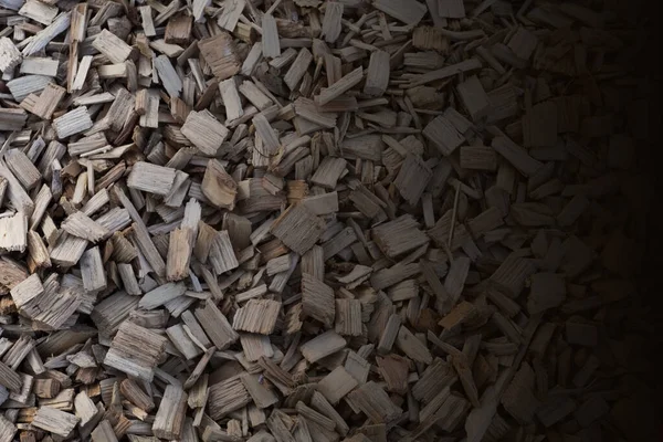 Wood sawdust isolated on white background, top view. Heap of sawdust isolated on white background. Wood sawdust on a white background, top view. Pile of wood shavings isolated on white background.