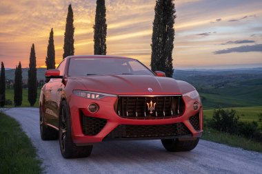 Maserati Levante GT Hybrid - Italian SUV with soft hybrid on the road in Tuscany clipart