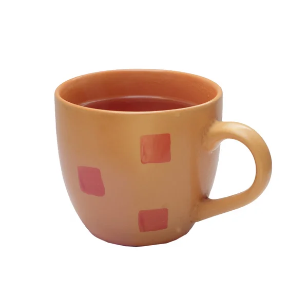 Маленькая оранжевая чашка чая — стоковое фото