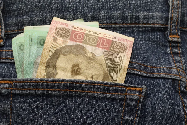 Denominations Ukrainian hryvnia in jeans pocket — Stock Photo, Image