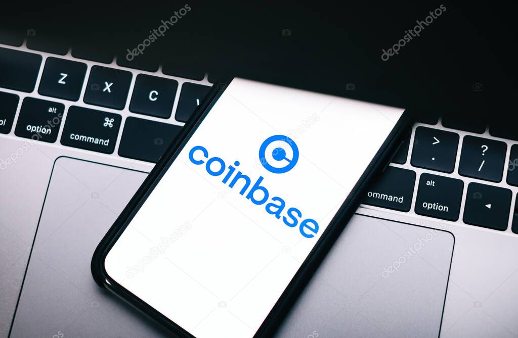 Coinbase logo on smartphone screen.