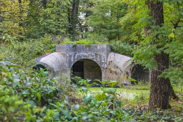 Unfinished abandoned bomb shelter made of durable concrete in a city park