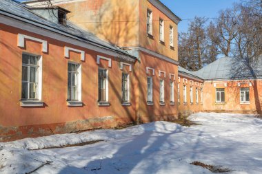 Olgovo, Dmitrov region, Russia - March 28, 2021: Part of the abandoned facade of the Apraksin Manor. Classicism of the late 18th century. Object of the cultural heritage of the peoples of the Russian Federation