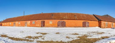 Olgovo, Dmitrov region, Russia - March 28, 2021: Part of the abandoned facade of the Apraksin Manor. Classicism of the late 18th century. Object of the cultural heritage of the peoples of the Russian Federation