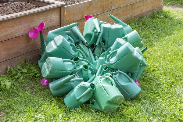 Plastic Watering Cans Irrigation Watering Flowers Plants Randomly Piled Heap — Stock Photo, Image