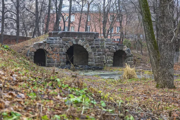 Unfinished abandoned bomb shelter made of durable concrete in a city park
