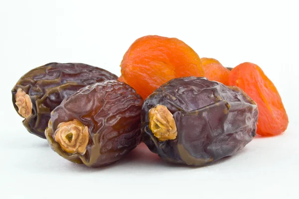 Sweet figs and dried apricots on white background — Stock Photo, Image