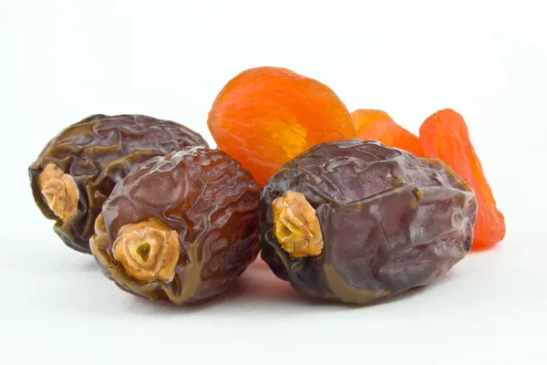 Sweet figs and dried apricots on white background — Stock Photo, Image