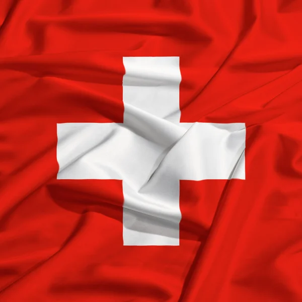 Switzerland flag on a silk drape — Stock Photo, Image