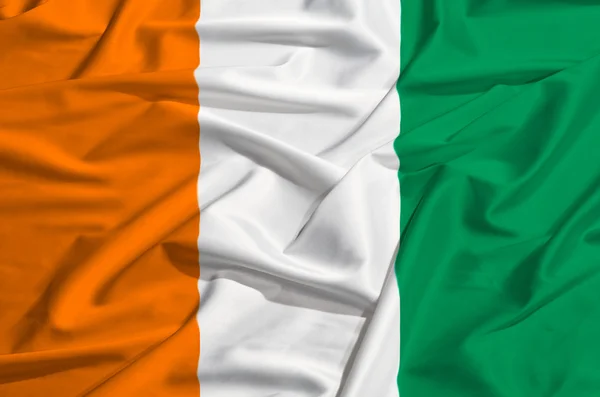 Ivory Coast flag on a silk drape — Stock Photo, Image