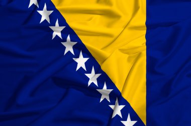İpek örtü sallayarak üzerinde Bosna bayrağı