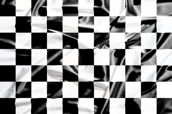 Drapeau d'échecs sur un rideau de soie agitant — Photo