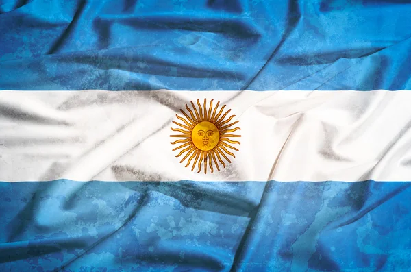 Grunge Bandera de Argentina sobre una cortina de seda ondeando —  Fotos de Stock