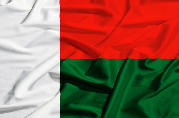 Madagascar flag on a silk drape waving — Stock Photo, Image