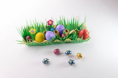 simple craft from paper and decorated egg holder, DIY instructions, recycling concept clipart