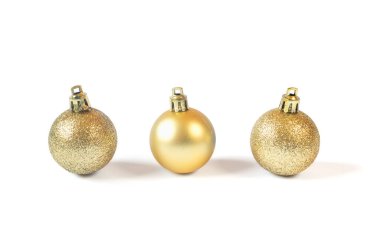 Three Golden baubles isolated on white background. Christmas decoration concept