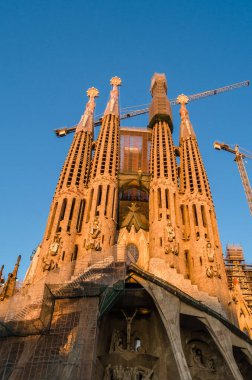 Exterior view of the famous Sagrada Familia, a large unfinished minor basilica in Barcelona, Catalonia, Spain, designed by the Catalan architect Antoni Gaudi