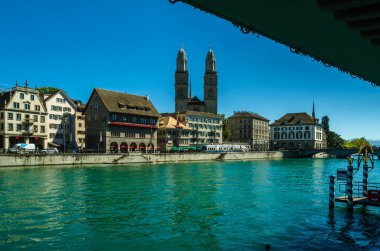 ZURICH, SWITZERLAND - SEPTEMBER 3, 2013: View of Zurich old town on the banks of the Limmat river