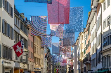 ZURICH, SWITZERLAND - SEPTEMBER 3, 2013: Shopping street in Zurich, Switzerland, decorated with multicolored banners