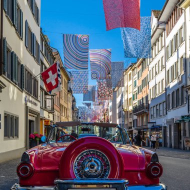 ZURICH, SWITZERLAND - SEPTEMBER 3, 2013: Shopping street in Zurich, Switzerland, decorated with multicolored banners