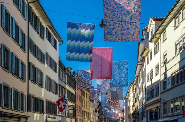ZURICH, SWITZERLAND - SEPTEMBER 3, 2013: Shopping street in Zurich, Switzerland, decorated with multicolored banners