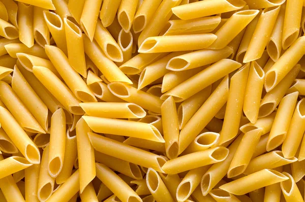 Pile Penne Pasta Noodles Background Close — 图库照片