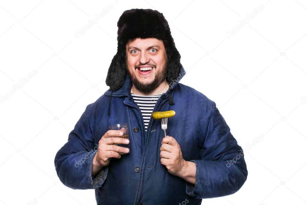 Happy, peaceful, crazy russian man with vodka and appetizer