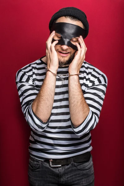 Sad thief with handcuffs — Stock Photo, Image