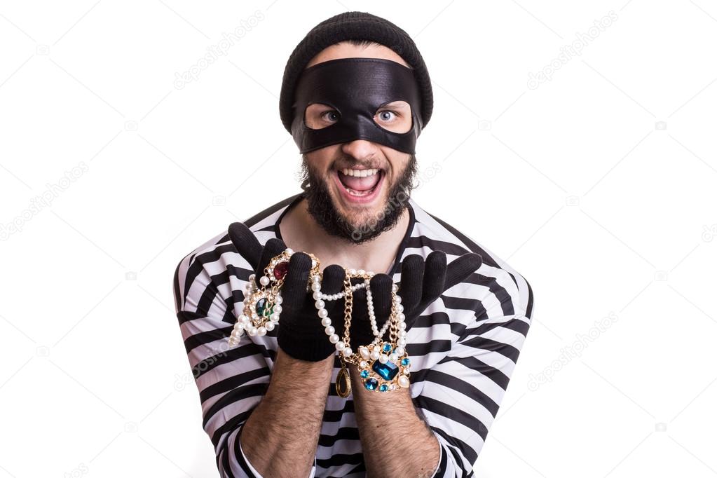 Bandit showing stolen jewelry and smiling