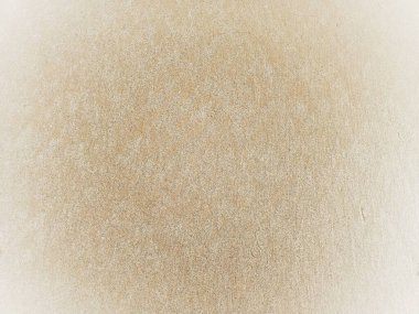 Kağıt desenli. Plaj kumlu arka plan. Deniz kenarındaki kumlu bir sahilin üst manzarası. Betikler ve görünür kum dokusu için arkaplan.