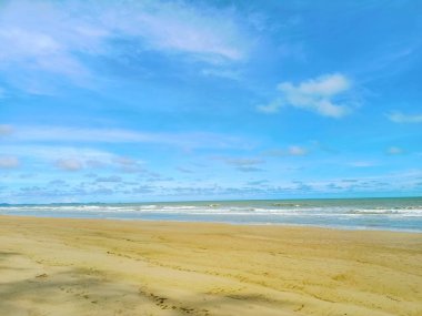 beach sand and blue sky.Yellow warm sand and summer sea with sky and free space.