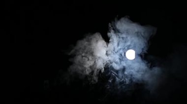 illuminated white smoke moves on a black background