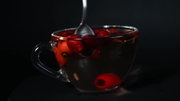 Cup Rosehip Tea Rotates Circle Rotating Platform Stir Tea Spoon — Stock Video