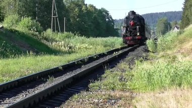 Republic of Karelia, Russia: Retro train on steam locomotive traction black and white video old movie.