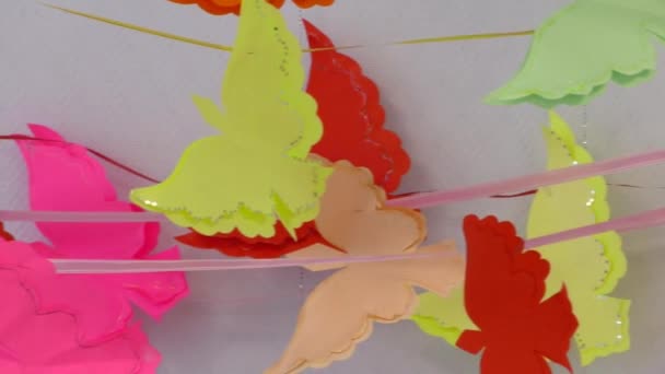 Background of paper garlands with butterfly figures. — Stock video