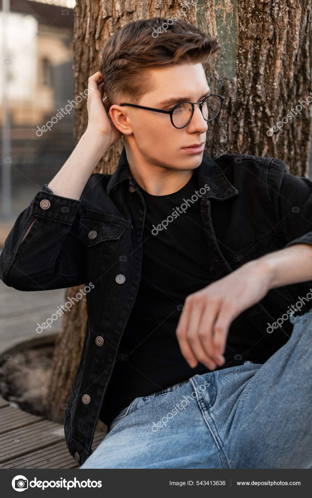 Modern Handsome Young Man Stylish Jeans Clothes Straightens Trendy Hairstyle  Stock Photo by ©alonesdj 543413636