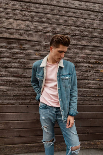 Fresh Portrait Fashionable European Young Man With Trendy Hairstyle In  Stylish Denim Blue Jacket With White Collar Posing On Street In City On  Summer Day. Urban Good-looking Guy Fashion Model Outdoors Stock