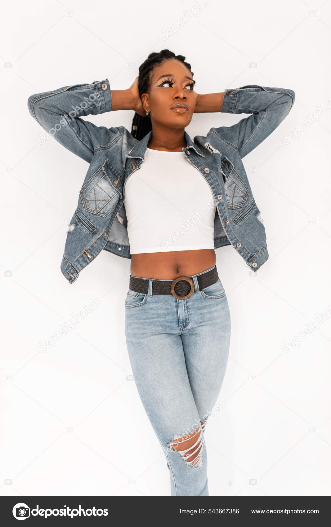 Attractive girl in a short jeans posing on white background. Stock Photo by  ©Artgo-biz 90893990