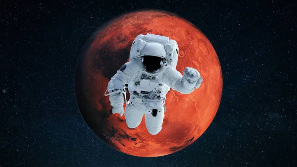 宇航员在红行星火星的背景下飞行 并在开放的空间执行任务 宇宙中的太空人 — 图库照片
