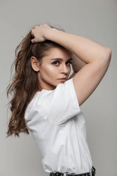 Beautiful Woman Corrects Her Hair Fashionable White Shirt Studio Female — Photo