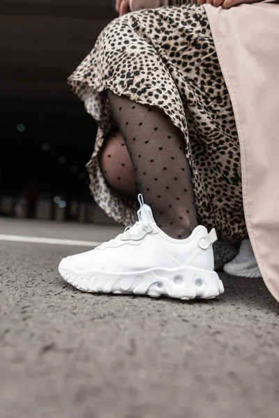 Stylish Woman Fashion White Sports Shoes Tights Leopard Dress Coat — стоковое фото